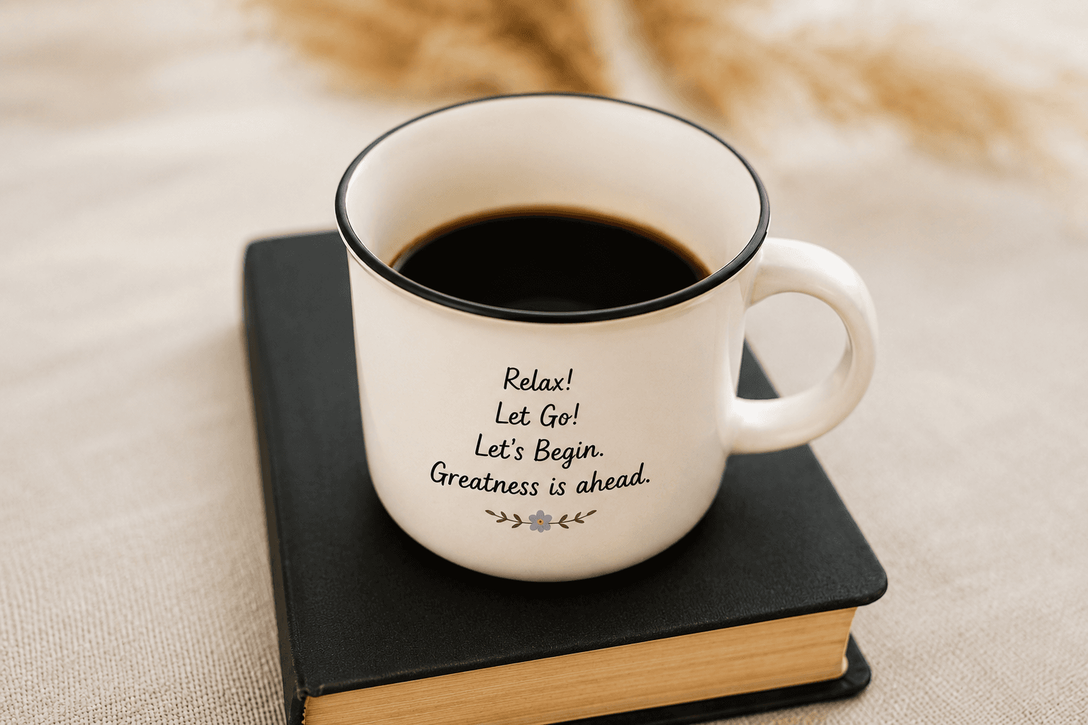 A warm mug of coffee resting on a closed book